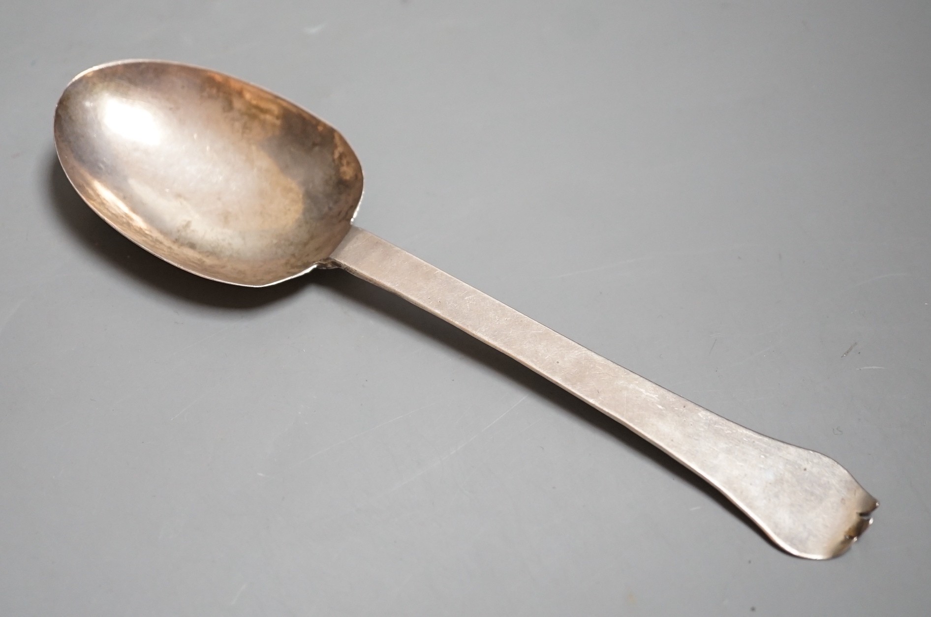 An early 18th century white metal trefid spoon, with engraved initials and date (repair), 19.1cm unmarked, 47 grams.